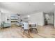 Bright living room featuring modern decor, wood-look floors and an electric fireplace at 1538 Mermaid Way, Haines City, FL 33844