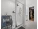 The ensuite bathroom features a glass shower, gray tile flooring, and walk in closet at 1538 Mermaid Way, Haines City, FL 33844