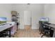 Spacious room with modern desks and light wood floors, ideal for a productive workspace at 1538 Mermaid Way, Haines City, FL 33844
