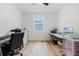 Versatile room featuring light wood floors and a window, perfect for an office or den at 1538 Mermaid Way, Haines City, FL 33844