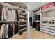 This large walk-in closet includes custom shelving, drawers, and organized storage space at 1538 Mermaid Way, Haines City, FL 33844
