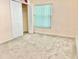 Bright bedroom with carpet and a window with blinds and a closet with bi-fold doors at 162 Seneca Point Trl, Kissimmee, FL 34746