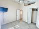 Bright bedroom featuring neutral paint, carpet, a ceiling fan, and ample closet space at 162 Seneca Point Trl, Kissimmee, FL 34746
