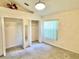 Cozy bedroom featuring a window, closet storage, and a ceiling fan at 162 Seneca Point Trl, Kissimmee, FL 34746