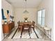 Bright dining room with a modern chandelier, perfect for Gathering meals and gatherings at 162 Seneca Point Trl, Kissimmee, FL 34746