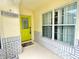 Inviting front entrance with a bright green door and a welcoming sign at 162 Seneca Point Trl, Kissimmee, FL 34746