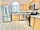 Well-equipped kitchen with stainless steel appliances and ample cabinet space at 162 Seneca Point Trl, Kissimmee, FL 34746