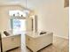 Bright and airy living room with high ceilings and access to the outdoor patio at 162 Seneca Point Trl, Kissimmee, FL 34746