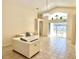 Inviting living room with tile floors, high ceilings, and sliding glass doors to a patio at 162 Seneca Point Trl, Kissimmee, FL 34746