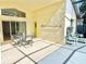Covered patio with outdoor dining and seating area and views of the backyard at 162 Seneca Point Trl, Kissimmee, FL 34746