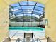 A view of the backyard pool with an enclosed screen and backyard hot tub at 162 Seneca Point Trl, Kissimmee, FL 34746