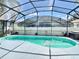 Inviting pool in a screened enclosure offering a refreshing escape and privacy at 162 Seneca Point Trl, Kissimmee, FL 34746