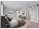 Stylish bedroom with neutral colors, art and barn door to other rooms at 1717 Hilltop Dr, Dundee, FL 33838