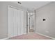 Bedroom with carpet, closet and neutral color paint at 1717 Hilltop Dr, Dundee, FL 33838