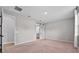 Bright bedroom features a sliding barn door to the ensuite bathroom at 1717 Hilltop Dr, Dundee, FL 33838