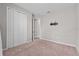 Bedroom with carpet flooring, neutral colored walls, and a walk-in closet at 1717 Hilltop Dr, Dundee, FL 33838