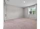 Bedroom featuring a window and barn door to the ensuite bathroom at 1717 Hilltop Dr, Dundee, FL 33838