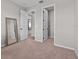 The bedroom has neutral walls, carpet and doors leading to the bathroom and closet at 1717 Hilltop Dr, Dundee, FL 33838