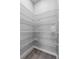 Spacious walk-in pantry with white wire shelving and ample storage space at 1717 Hilltop Dr, Dundee, FL 33838