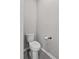 Toilet in a small room with hard flooring and gray paint at 1717 Hilltop Dr, Dundee, FL 33838