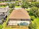 Aerial view of a home with a screened-in pool area, patio, and lush landscaping, creating a private backyard oasis at 1902 Tumblewater Blvd, Ocoee, FL 34761