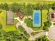 Aerial view showcasing community amenities: basketball court, playground, tennis court, parking area, and lush greenery at 1902 Tumblewater Blvd, Ocoee, FL 34761