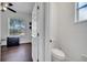 View from the doorway to the office and into a toilet room in the bathroom at 1902 Tumblewater Blvd, Ocoee, FL 34761