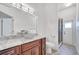 Bathroom featuring granite countertops, vessel sink, and glass-enclosed shower at 1902 Tumblewater Blvd, Ocoee, FL 34761
