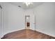 Bright bedroom with hardwood floors, ceiling fan, and door to bathroom at 1902 Tumblewater Blvd, Ocoee, FL 34761