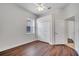 Bedroom with wood-look floors, window, and closet at 1902 Tumblewater Blvd, Ocoee, FL 34761