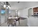 Bright breakfast nook offers a modern chandelier and easy access to the kitchen at 1902 Tumblewater Blvd, Ocoee, FL 34761