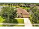 Charming front exterior featuring a well-manicured lawn and attached two-car garage at 1902 Tumblewater Blvd, Ocoee, FL 34761