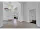 Bright foyer with tile floors, chandelier, high ceilings, and entry to the office at 1902 Tumblewater Blvd, Ocoee, FL 34761