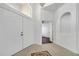 Bright foyer featuring tile floors, a decorative mosaic, chandelier, and entry to other rooms at 1902 Tumblewater Blvd, Ocoee, FL 34761