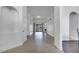 Bright hallway showcasing tile floors, arched doorways, and access to the outdoor area at 1902 Tumblewater Blvd, Ocoee, FL 34761