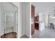 Hallway view to kitchen and bathroom with tiled floors at 1902 Tumblewater Blvd, Ocoee, FL 34761