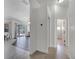Hallway view of an open floor plan with dark and light flooring at 1902 Tumblewater Blvd, Ocoee, FL 34761