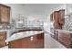 Open concept kitchen with marble countertops and stainless steel appliances at 1902 Tumblewater Blvd, Ocoee, FL 34761