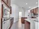 Gourmet kitchen featuring stainless steel appliances, and custom cabinetry at 1902 Tumblewater Blvd, Ocoee, FL 34761