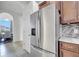 Modern kitchen features stainless steel refrigerator and stylish tile backsplash at 1902 Tumblewater Blvd, Ocoee, FL 34761