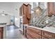 The kitchen features stainless steel appliances, modern cabinets, and a tile backsplash at 1902 Tumblewater Blvd, Ocoee, FL 34761
