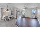 Spacious living room with sliding doors to a screened patio and dark hardwood floors at 1902 Tumblewater Blvd, Ocoee, FL 34761