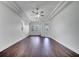 Spacious living room featuring modern ceiling fan, hardwood floors, and natural lighting at 1902 Tumblewater Blvd, Ocoee, FL 34761