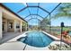 A lovely screened-in pool with palm trees and plenty of space to lounge around in the sun at 1902 Tumblewater Blvd, Ocoee, FL 34761