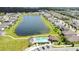 A distant overhead view of community pool and retention pond in residential neighborhood at 2009 Napoli Dr, St Cloud, FL 34771