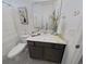 Well-lit bathroom with a modern vanity, and framed wall art at 2009 Napoli Dr, St Cloud, FL 34771