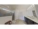 Spacious bathroom with a tiled shower, double vanity, and modern fixtures at 2009 Napoli Dr, St Cloud, FL 34771