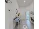 Bright entryway with a decorative table, mirror, and stylish decor at 2009 Napoli Dr, St Cloud, FL 34771