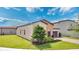 Charming home featuring an attached garage, well-manicured lawn, and landscaped surroundings at 2009 Napoli Dr, St Cloud, FL 34771