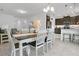 Open concept kitchen and dining area with stainless steel appliances and plenty of natural light at 2009 Napoli Dr, St Cloud, FL 34771